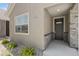 Close-up of the front entryway, highlighting the modern front door and stone accents at 311 Josef Cir, Fort Lupton, CO 80621