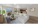 Inviting living room flowing into the kitchen area, perfect for entertaining and relaxation at 311 Josef Cir, Fort Lupton, CO 80621
