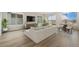 Bright and open living room featuring hardwood floors, large windows, and modern furniture at 311 Josef Cir, Fort Lupton, CO 80621
