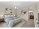Calm main bedroom with carpet and ensuite bathroom at 311 Josef Cir, Fort Lupton, CO 80621