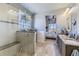 Spa-like bathroom with a large walk-in shower, double vanity, and a view to the bedroom at 592 Bristolwood Ln, Castle Pines, CO 80108