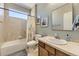 Guest bathroom with a tub, toilet, and single vanity at 592 Bristolwood Ln, Castle Pines, CO 80108