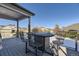 Deck with a fire pit table and seating at 592 Bristolwood Ln, Castle Pines, CO 80108