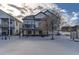 Home's exterior with snowy yard and deck at 592 Bristolwood Ln, Castle Pines, CO 80108