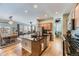 Kitchen with granite island, stainless steel appliances, and hardwood floors at 592 Bristolwood Ln, Castle Pines, CO 80108