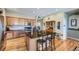 Spacious kitchen with an island, hardwood floors, and ample cabinet space at 592 Bristolwood Ln, Castle Pines, CO 80108