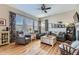 Bright living room featuring hardwood floors and comfortable seating at 592 Bristolwood Ln, Castle Pines, CO 80108