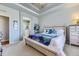 Main bedroom with ensuite bathroom and carpeted floors at 592 Bristolwood Ln, Castle Pines, CO 80108