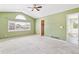 Spacious bedroom with vaulted ceilings, large window, ceiling fan, and ensuite bath at 2330 S Salem Cir, Aurora, CO 80014