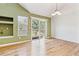 Bright living room with vaulted ceilings, a fireplace, and sliding door access to the deck at 2330 S Salem Cir, Aurora, CO 80014