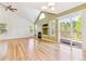Spacious living room featuring a fireplace, a sliding door to the outside and hardwood floors at 2330 S Salem Cir, Aurora, CO 80014
