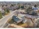 Aerial view of gray house with fenced yard, patio and mature trees at 4080 E Caley Cir, Centennial, CO 80121