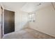 Bedroom with double-door closet, carpet, and window with sheered curtains at 4080 E Caley Cir, Centennial, CO 80121