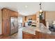 Kitchen featuring stainless steel appliances, granite countertops and access to the backyard at 4080 E Caley Cir, Centennial, CO 80121