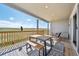 Enjoy your morning coffee at this table set on this covered back deck with a great view at 6980 S Yantley Ct, Aurora, CO 80016