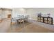 Spacious basement area featuring a large table and chairs, with a storage cabinet and space for recreation at 6980 S Yantley Ct, Aurora, CO 80016