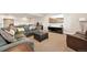 Finished basement with a comfortable sectional sofa, TV, and media center at 6980 S Yantley Ct, Aurora, CO 80016