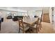 Spacious basement area featuring a dining table and comfortable seating area, great for entertaining at 6980 S Yantley Ct, Aurora, CO 80016