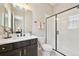 Contemporary bathroom features a glass-enclosed shower, and dark vanity at 6980 S Yantley Ct, Aurora, CO 80016