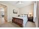 Well-lit bedroom showcasing a comfortable bed, neutral walls, and a large window at 6980 S Yantley Ct, Aurora, CO 80016