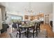 Open-concept dining room and living area provides ample space for gatherings, complete with a seamless flow to the kitchen at 6980 S Yantley Ct, Aurora, CO 80016