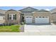 Charming single-story home with a well-manicured lawn and a convenient three-car garage, located in a desirable neighborhood at 6980 S Yantley Ct, Aurora, CO 80016