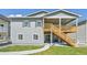 Two-story home with a walk-out basement and a wooden deck overlooking the backyard at 6980 S Yantley Ct, Aurora, CO 80016