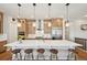 Bright kitchen features a spacious island, pendant lighting, and ample cabinet space at 6980 S Yantley Ct, Aurora, CO 80016