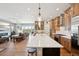 Open floor plan shows the flow between kitchen, living room, and outdoor deck with views at 6980 S Yantley Ct, Aurora, CO 80016