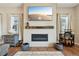 Comfortable living room with modern decor, a wall-mounted TV, and stylish accents at 6980 S Yantley Ct, Aurora, CO 80016