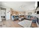 Spacious living area with open access to the kitchen and dining areas, creating a seamless and inviting flow at 6980 S Yantley Ct, Aurora, CO 80016
