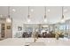 Bright and open living space features a large island, adjacent living room and dining room at 6980 S Yantley Ct, Aurora, CO 80016