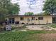 Backyard featuring a patio area, ample space for outdoor activities, and mature landscaping at 7409 Pierce St, Arvada, CO 80003