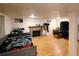 Open basement design with a decorative fireplace and hearth provides a cozy and inviting atmosphere at 7409 Pierce St, Arvada, CO 80003