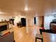 Expansive finished basement with a fireplace and kitchenette offers endless possibilities for living and entertaining at 7409 Pierce St, Arvada, CO 80003