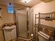 Charming bathroom features a glass shower door, vanity sink, and decorative tile for a unique design at 7409 Pierce St, Arvada, CO 80003