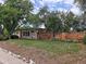 Charming home with a stone accent wall, well-maintained lawn, and a red front door at 7409 Pierce St, Arvada, CO 80003