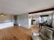 Spacious living room with seamless flow into dining area and hardwood flooring at 7409 Pierce St, Arvada, CO 80003