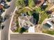 Birds eye view of the residence highlighting the roof, driveway, and landscaping at 10831 Eagle Crest Ln, Parker, CO 80138