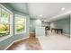 Finished basement with a bar area, tile and carpet flooring and abundant natural light at 10831 Eagle Crest Ln, Parker, CO 80138