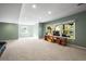 Large basement area featuring neutral carpeting and ample natural lighting at 10831 Eagle Crest Ln, Parker, CO 80138