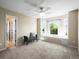 Empty bedroom with large windows, neutral paint, and a dark gray upholstered bench at 10831 Eagle Crest Ln, Parker, CO 80138