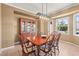 Formal dining room with classic wood furniture and bright window at 10831 Eagle Crest Ln, Parker, CO 80138