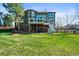 Two-story home featuring a walk-out basement, expansive yard, and spacious deck at 10831 Eagle Crest Ln, Parker, CO 80138