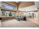 Open living room featuring a fireplace, large windows, open floor plan and plush carpet at 10831 Eagle Crest Ln, Parker, CO 80138