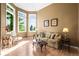 Bright living room featuring large windows, wood floors, and stylish decor at 10831 Eagle Crest Ln, Parker, CO 80138