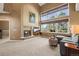 Cozy living room featuring a fireplace, large windows and a comfortable sofa at 10831 Eagle Crest Ln, Parker, CO 80138
