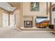 Living room featuring a fireplace, large windows, neutral paint and plush carpet at 10831 Eagle Crest Ln, Parker, CO 80138
