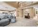 Spacious living room with open layout, large windows and views into the kitchen at 10831 Eagle Crest Ln, Parker, CO 80138