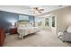 Spacious main bedroom with a bay window, ceiling fan, and tufted headboard at 10831 Eagle Crest Ln, Parker, CO 80138
